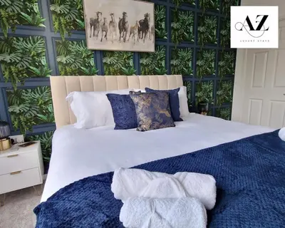 a bedroom with a white bed and a green wall at Mansion House Apartment,WIFI,FAMILY,CONTRACTORS in Newmarket