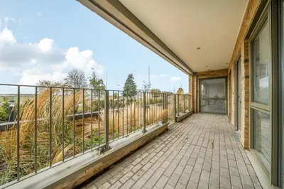 a balcony with a view of the countryside at Peaceful and stylish apartment near Cambridge with parking in CBG