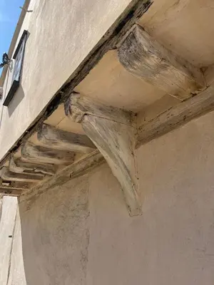 a wooden beam on the side of a building at Taper House - Cosy Medieval Cottage in Kersey