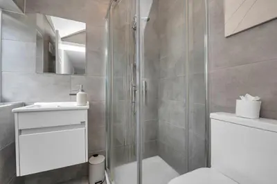 a bathroom with a shower and a toilet and a sink at Weekly Deal- 4BDR House By Homestyles Hosts Short Lets & Serviced Accommodation Suffolk With Private En-Suite & Free Parking in Ipswich