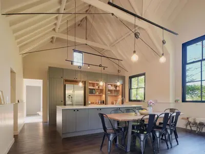 a kitchen and dining room with a table and chairs at The Church Hall in Ipswich