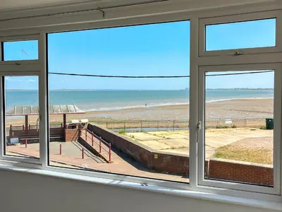 a view of the beach from a window at Thirslet in Maldon