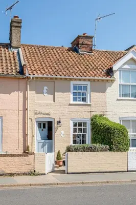 a white brick house with a brown roof at Seahorse Cottage, Aldeburgh - sleeps 4 - Adult only property - Managed by Aldeburgh Coastal Cottages in Aldeburgh