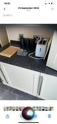 a kitchen counter with a toaster on a counter top at Hadleigh Caravans at Seawick Clacton in Clacton-on-Sea
