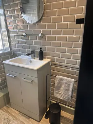 a bathroom with a sink and a mirror at 2 Bedroom Cottage in Debenham - The Old Toll House in Debenham