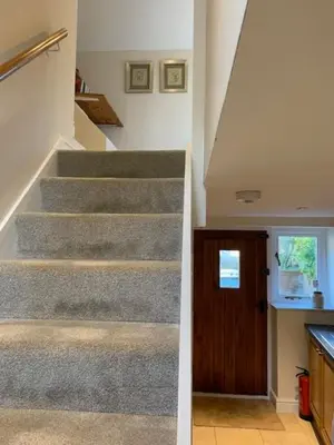 a staircase in a house with a stair case at The Pightle Annexe in Saffron Walden