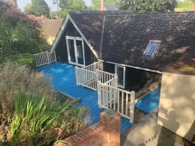 an aerial view of a house with a blue deck at The Pightle Annexe in Saffron Walden