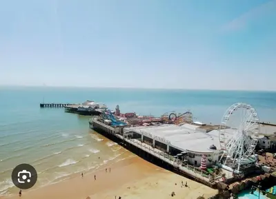 an aerial view of a beach with a amusement park at The Pink Lady in Walton-on-the-Naze