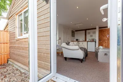 a view of a living room and kitchen from a door at Stansted airport - studio annexe with parking in Hatfield Broad Oak