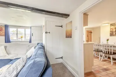 a living room with a bed and a kitchen at 3 Bed in Stowupland oc-p32216 in Stowmarket
