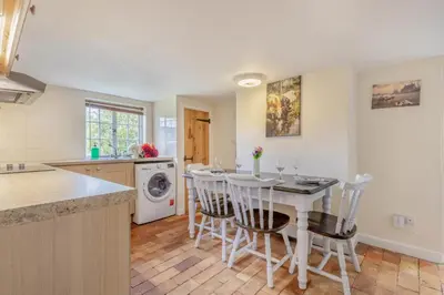 a kitchen with a table and chairs in a kitchen at 3 Bed in Stowupland oc-p32216 in Stowmarket