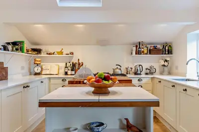 a kitchen with a bowl of fruit on a counter at 4 Bed in Sudbourne oc-w32267 in Sudbourne