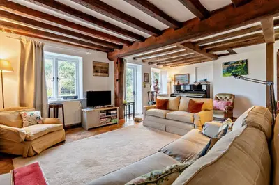 a living room with a couch and a tv at 4 Bed in Sudbourne oc-w32267 in Sudbourne