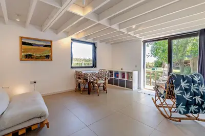 a living room with a bed and a table and chairs at 2 Bed in Sudbourne oc-w32264 in Sudbourne