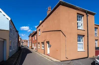 an empty street in an old brick building at Pebbles, King St - Aldeburgh Coastal Cottages in Aldeburgh