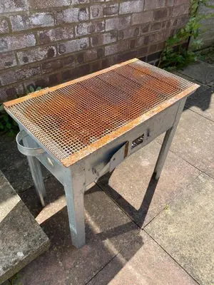 a bench sitting on a sidewalk next to a brick wall at Modern-PetFriendly-privateGarden-Family-20MinToLDN in Stevenage