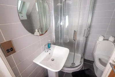 a bathroom with a sink and a shower and a toilet at Newly Renovated Sanctuary for 4 in Tacket Street, Ipswich in Ipswich