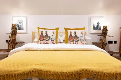 a bedroom with a bed with four birds on it at Fairytale Staycation - Near London by Damask Homes in Stapleford Tawney