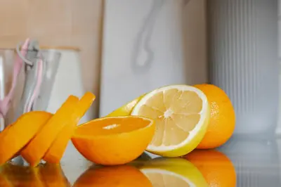 a group of oranges and carrots on a counter at Stylish 5Bedroom Getaway in Quiet Mildenhall Area in Mildenhall