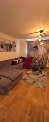 a living room with a couch and a rug at 1 bed luxurious flat in Basildon