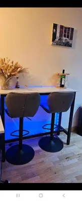 a desk with two chairs in a room at 1 bed luxurious flat in Basildon