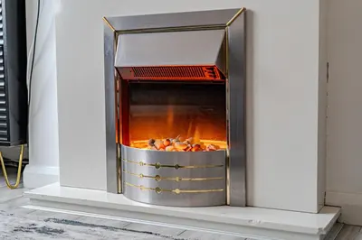 a fire pit in a fireplace with food inside at Stylish Southend Stay in Southend-on-Sea
