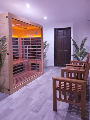 a room with a bench and a large window at The Courtyard Lodge in Hitchin