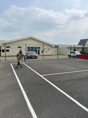 a man playing tennis on a tennis court at Rohannah A&C Ultimate Caravan Retreat in East Mersea