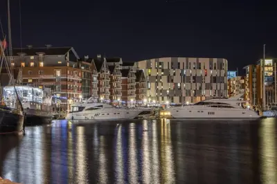 a group of boats docked in a harbor at night at Weekday Special - 4BDR House By Homestyles Hosts Short Lets & Serviced Accommodation Ipswich Near Town Centre With Free Parking in Ipswich