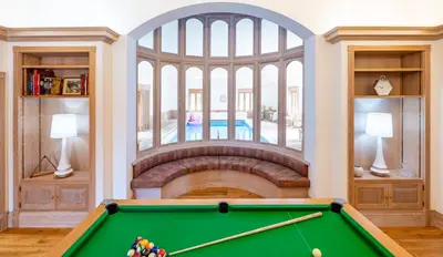a pool table in a room with a fireplace at Large indoor swimming pool in Thetford Forest - The Pool House in Downham