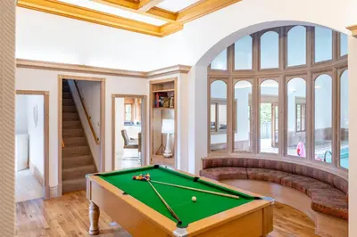 a living room with a pool table at Large indoor swimming pool in Thetford Forest - The Pool House in Downham