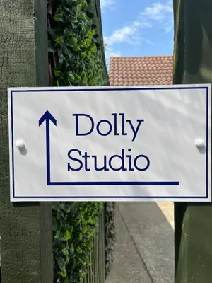 a sign that reads dolly studio attached to a building at Dolly Studio in Colchester