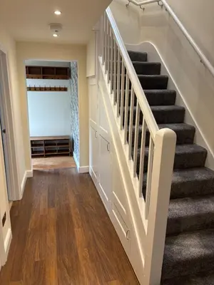 a staircase in a home with wood floors at Stylish 2 bed apartment - easy walk to Addenbrookes in Cambridge