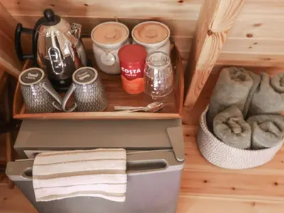 a drawer in a kitchen with a coffee maker and towels at Oak Tree in Woodbridge