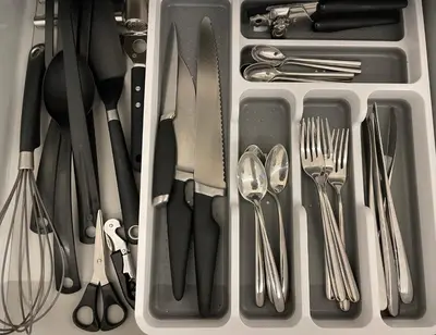 a drawer filled with utensils including forks and spoons at Boutique Cottage by Bishop's Stortford train station, easy to Stansted Airport & Parking in Bishops Stortford
