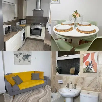 a kitchen with a table and a yellow couch in a room at Long Stay Basildon Essex Business Contractors in Basildon
