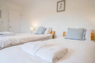 two beds sitting next to each other in a room at Cherry Tree House, Aldeburgh in Aldeburgh
