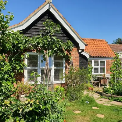 a house with a garden in front of it at Little Furrows, Wenhaston in Wenhaston
