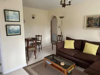 a living room with a couch and a table at Little Furrows, Wenhaston in Wenhaston