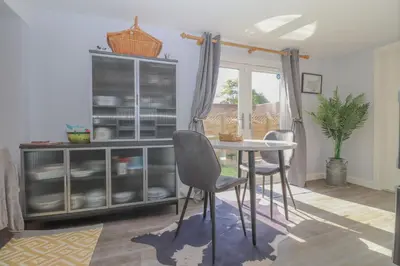 a dining room with a table and chairs at Gorgeous rural dog welcoming Milk Churn - Suffolk in Eye