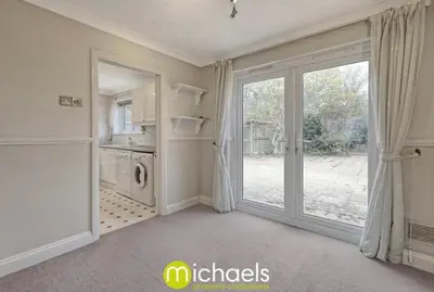 a laundry room with a door to a yard at For Contractors, businesses, families - next to Colchester Royal Grammar School in Lexden