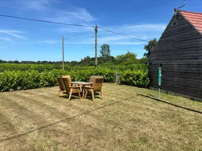 a table and chairs sitting in a yard at The Lodge in Newbourn
