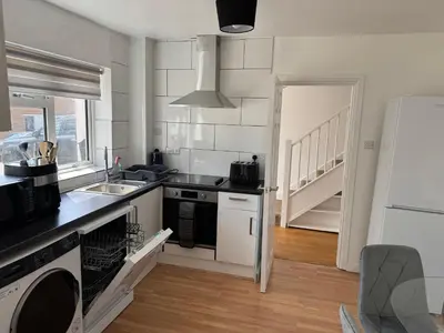 a kitchen with a sink and a stove at 3 bedrooms house in Stevenage