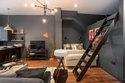 a living room with a bunk bed and a couch at Large Studio Apartment, Free Parking, Close to Centre in Southend-on-Sea