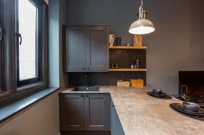 a kitchen with a sink and a window at Large Studio Apartment, Free Parking, Close to Centre in Southend-on-Sea
