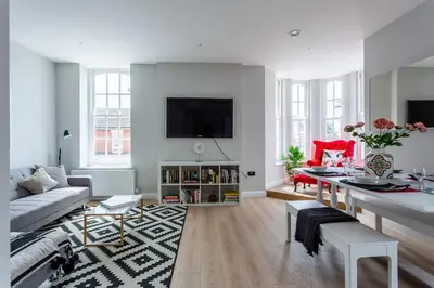 a living room with a couch and a table at 2BR Apartments in Southend near City Centre in Southend-on-Sea