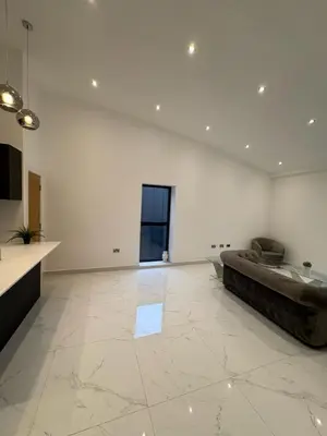 a large white room with a couch in the middle at Amazing 3-bedroom in Great Warley, Brentwood in Great Warley Street