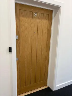 a wooden door with a number on it in a room at Amazing 3-bedroom in Great Warley, Brentwood in Great Warley Street