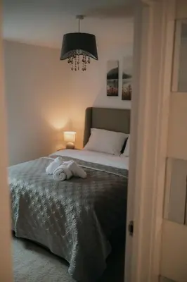 a bedroom with a bed with a towel on it at Modern Stay - Walk to Everything 1 in Ipswich