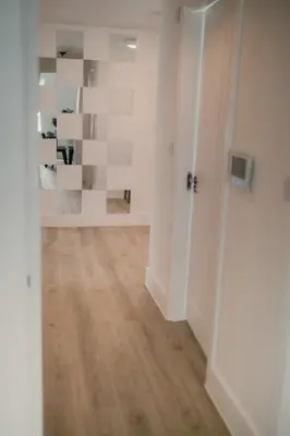 an empty room with white walls and wooden floors at Modern Stay - Walk to Everything 1 in Ipswich